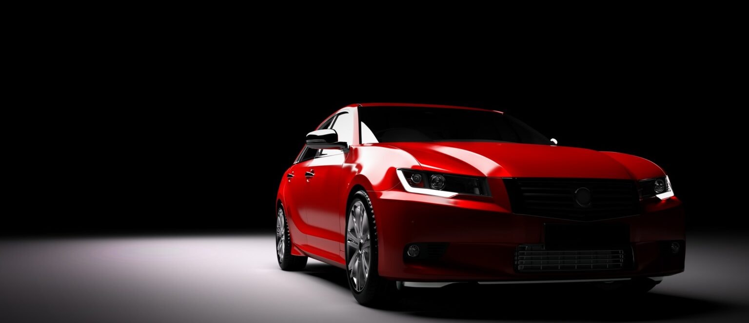 Red sports car with dramatic studio lighting